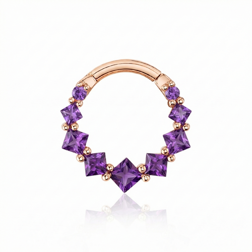 Rose gold nose ring with purple gemstones on a white background