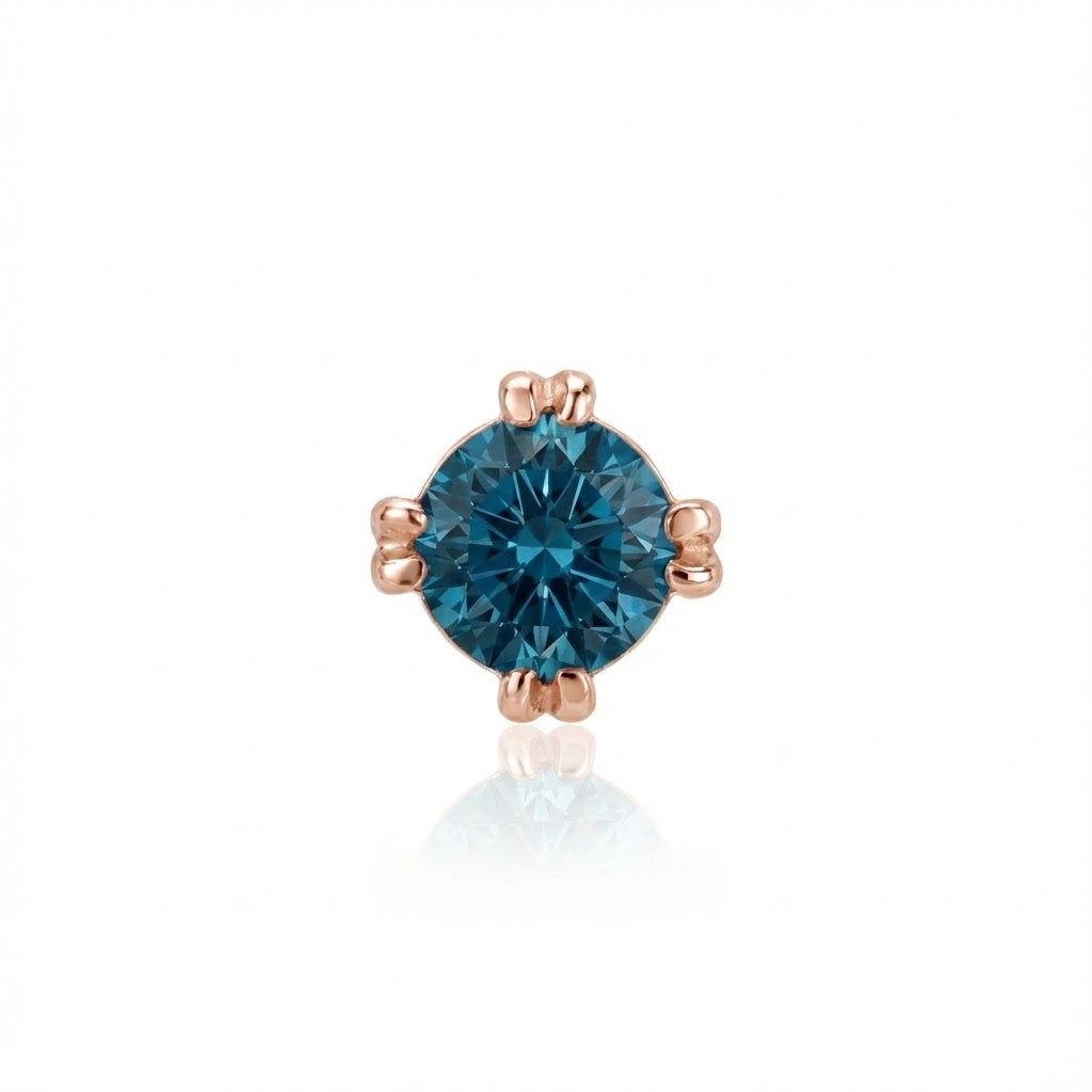 Single-stone blue diamond earring with rose gold setting on a white background