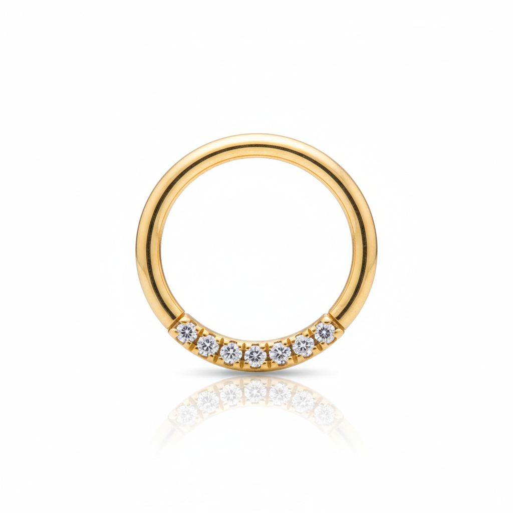 Gold ring with small diamonds on a white background