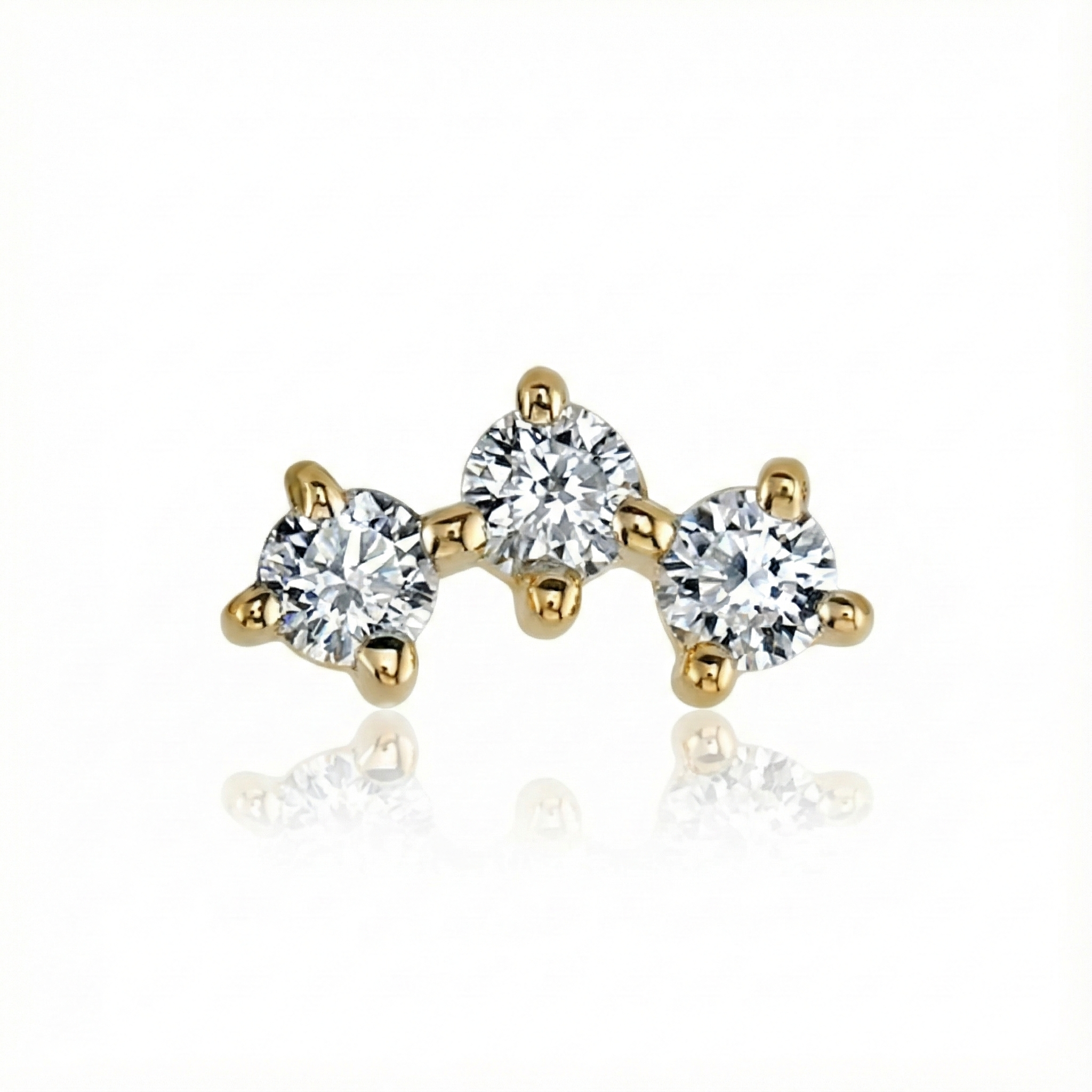 Gold and diamond stud earrings on a white background