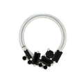 Black and silver jewelry piece on a white background