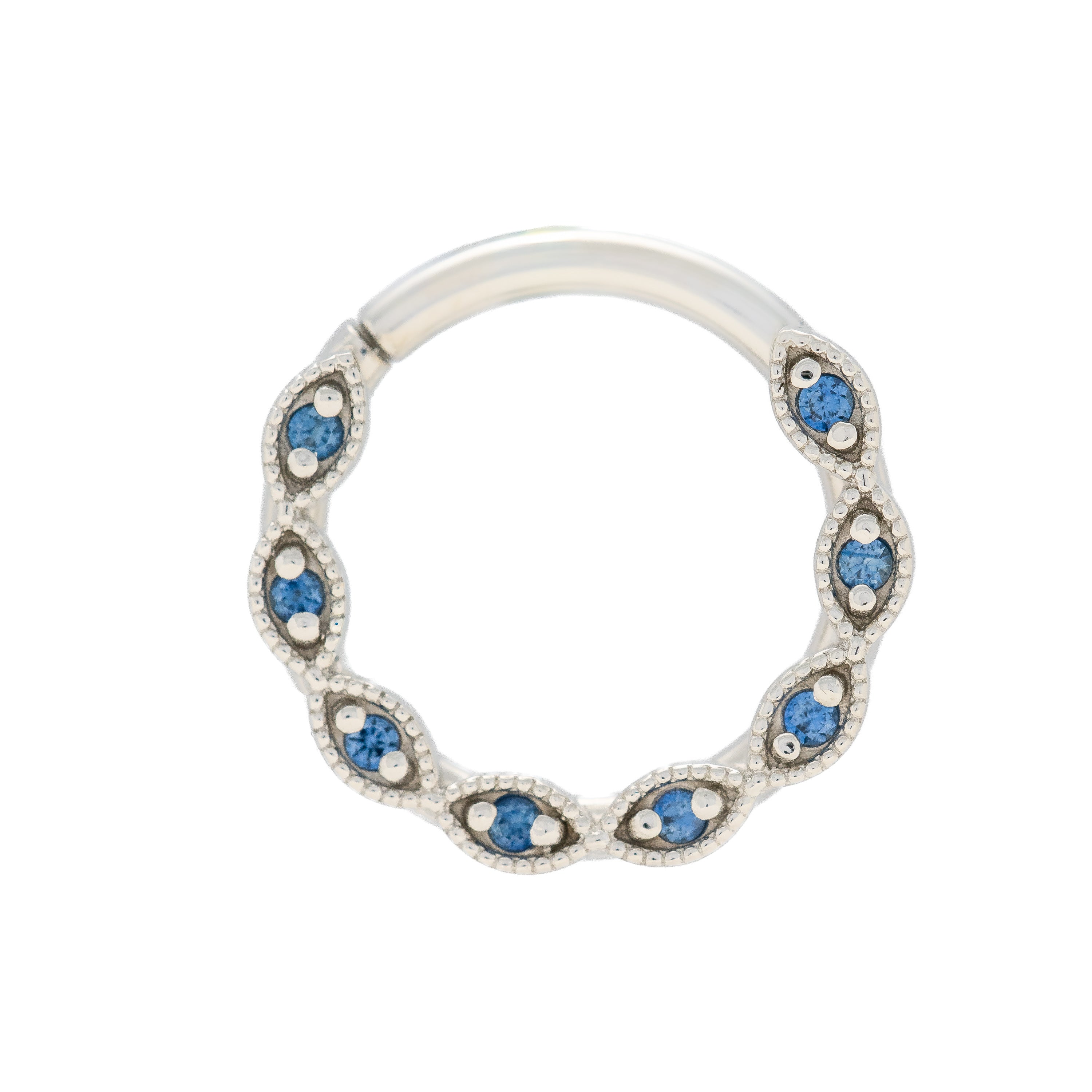 Silver ring with blue gemstones on a white background