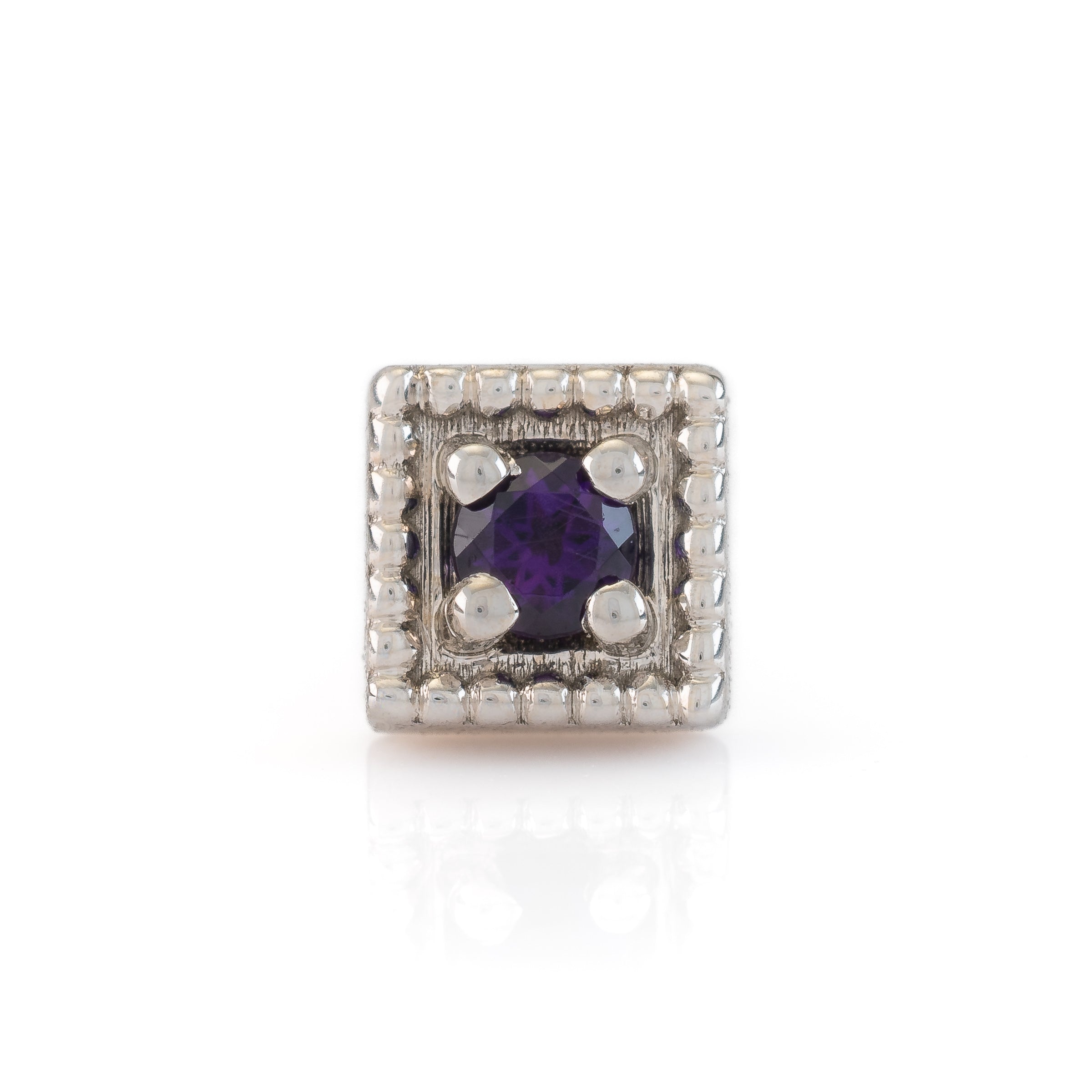 white gold end with a purple gemstone on a white background