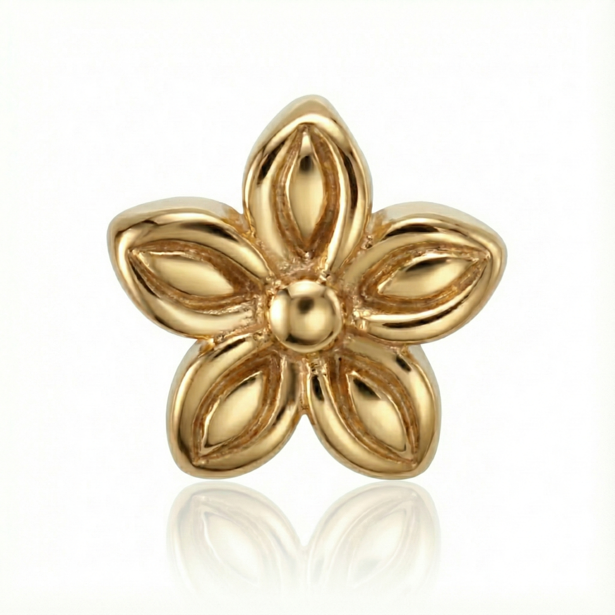 Gold flower-shaped earring on a white background