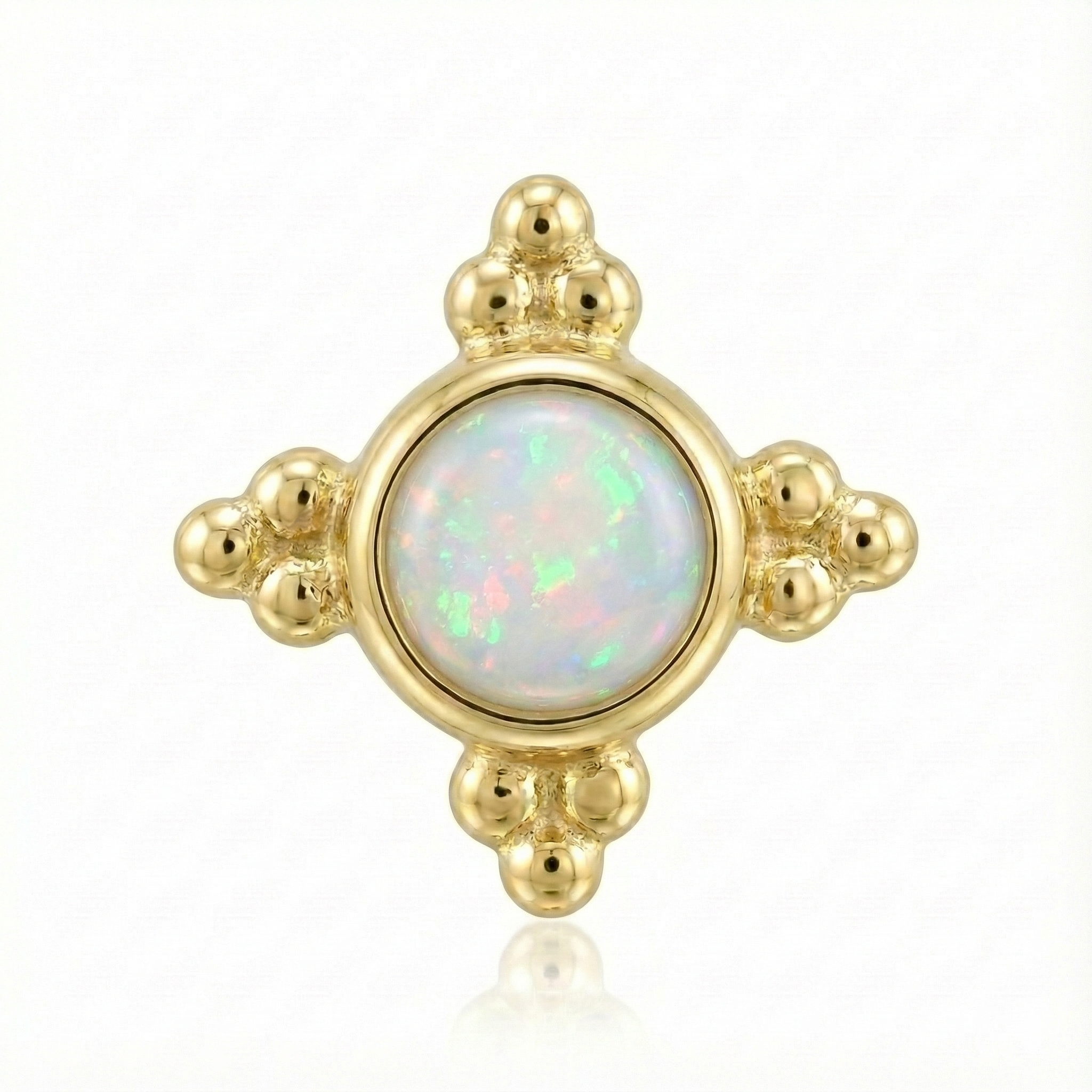 Gold earring with a central opal stone on a white background