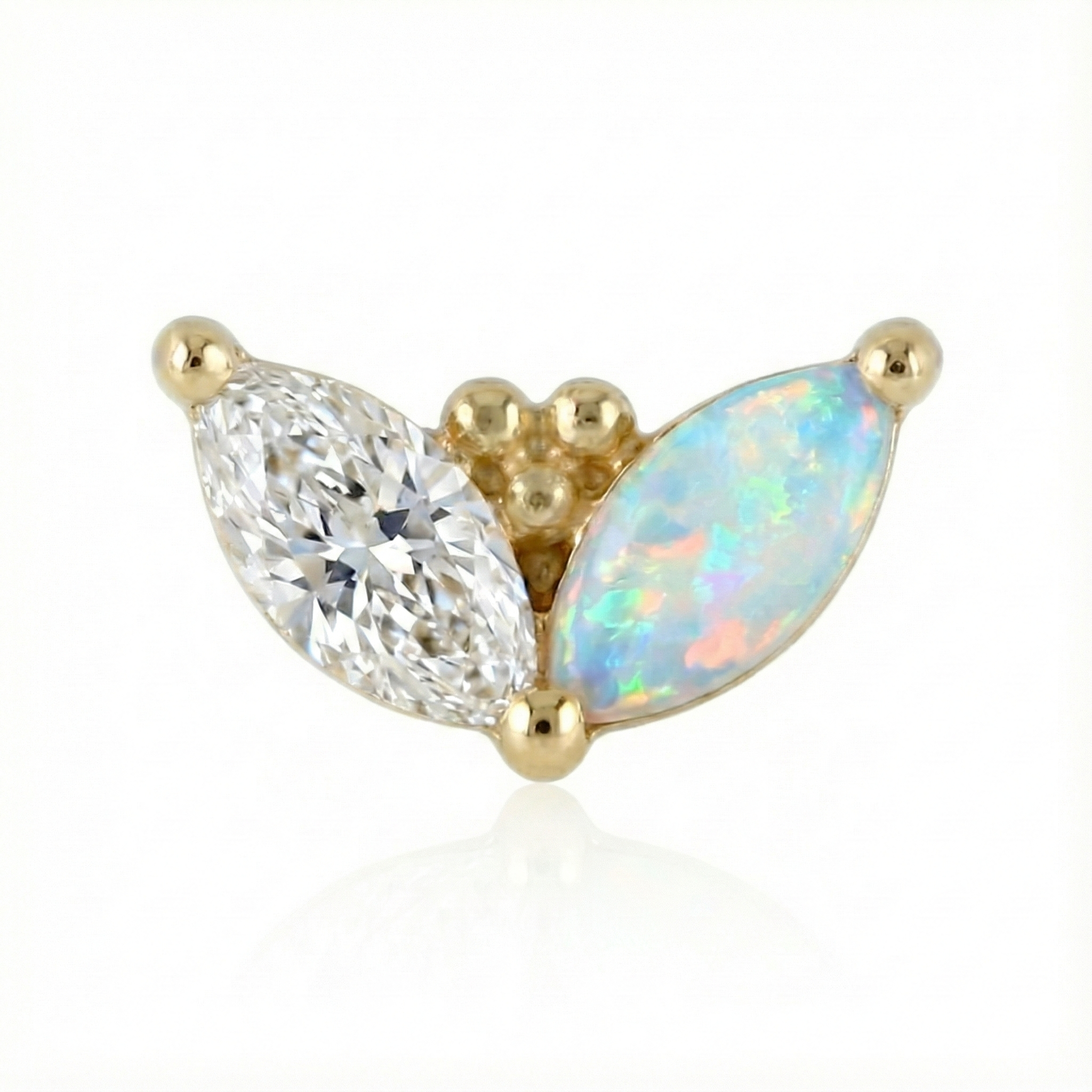 Gold earring with a diamond and opal stone on a white background